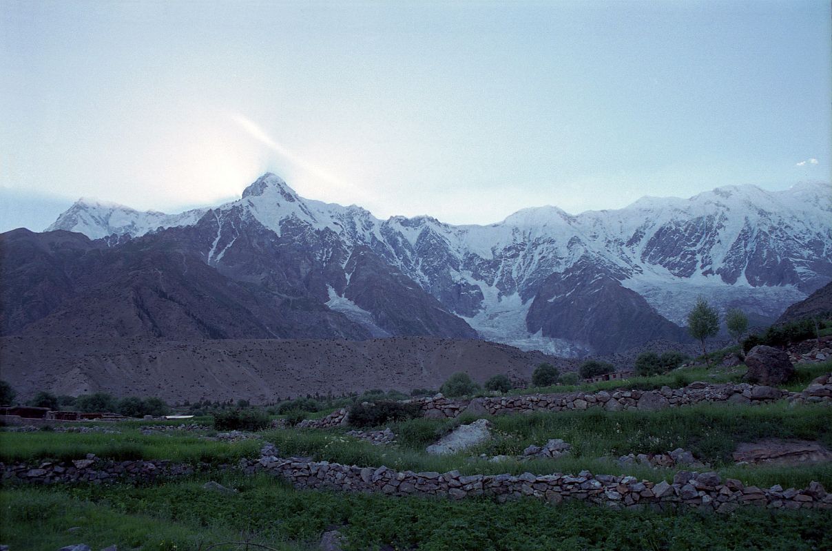 04 Nanga Parbat Rupal And East Faces, Rakhiot Peak, And Chongra Peaks From Tarashing At Sunset At sunset from Tarashing, Nanga Parbat Rupal and East Faces, Rakhiot Peak, and Chongra Peaks were backlit by the sun.